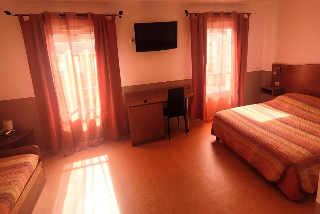 Postel nebo postele na pokoji v ubytování Hôtel de l'Orb