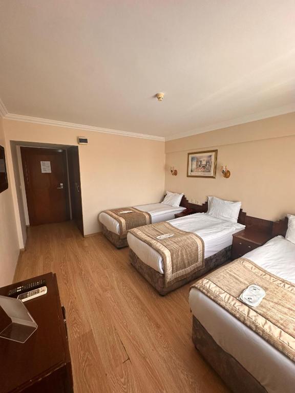 Postel nebo postele na pokoji v ubytování Hotel Akyildiz