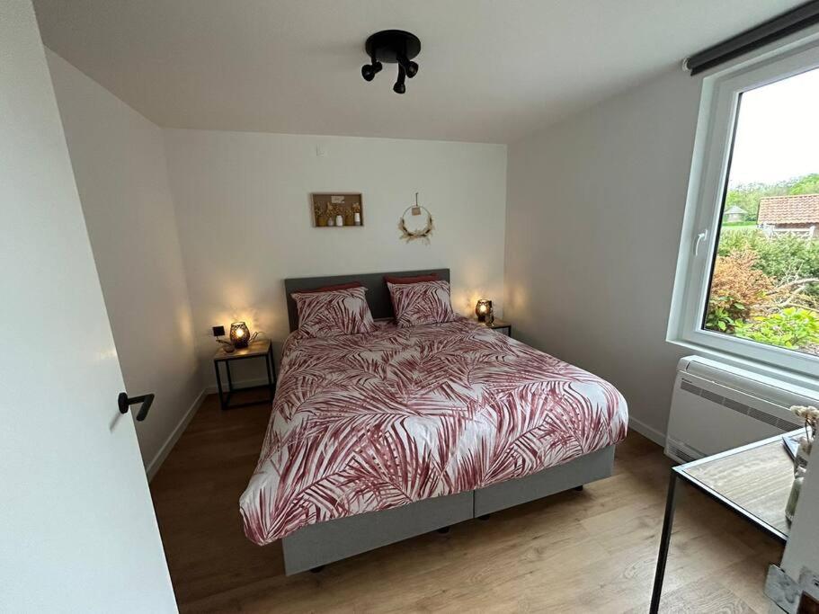 Postel nebo postele na pokoji v ubytování Vakantiehuis Laurine