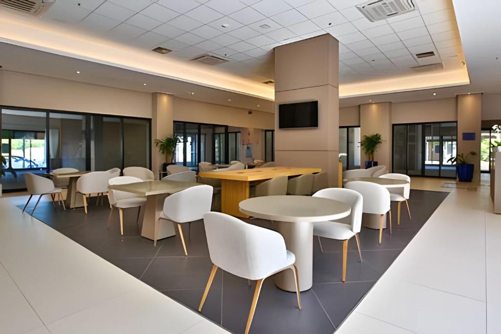 TV a/nebo společenská místnost v ubytování Flat & Lounge SQUARE FARIA LIMA