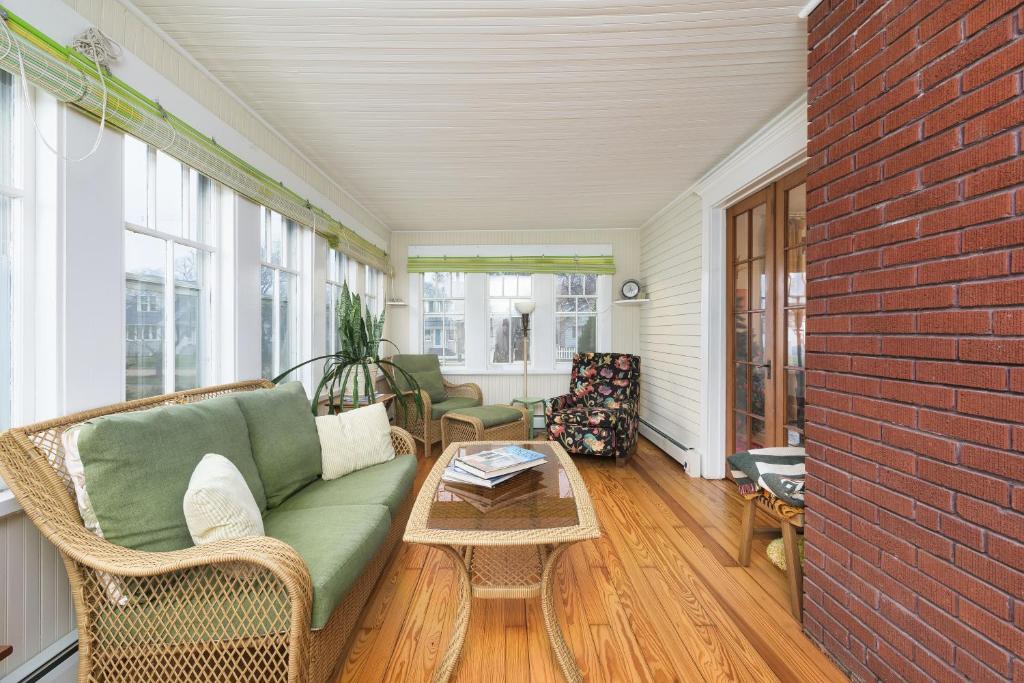 a living room with a couch and a table at Clinton Street Retreat -Dog Friendly- Close to downtown in South Haven