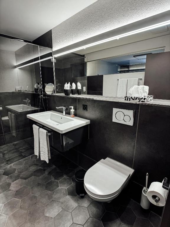 Koupelna v ubytování Boutique Hotel Sonne Seuzach