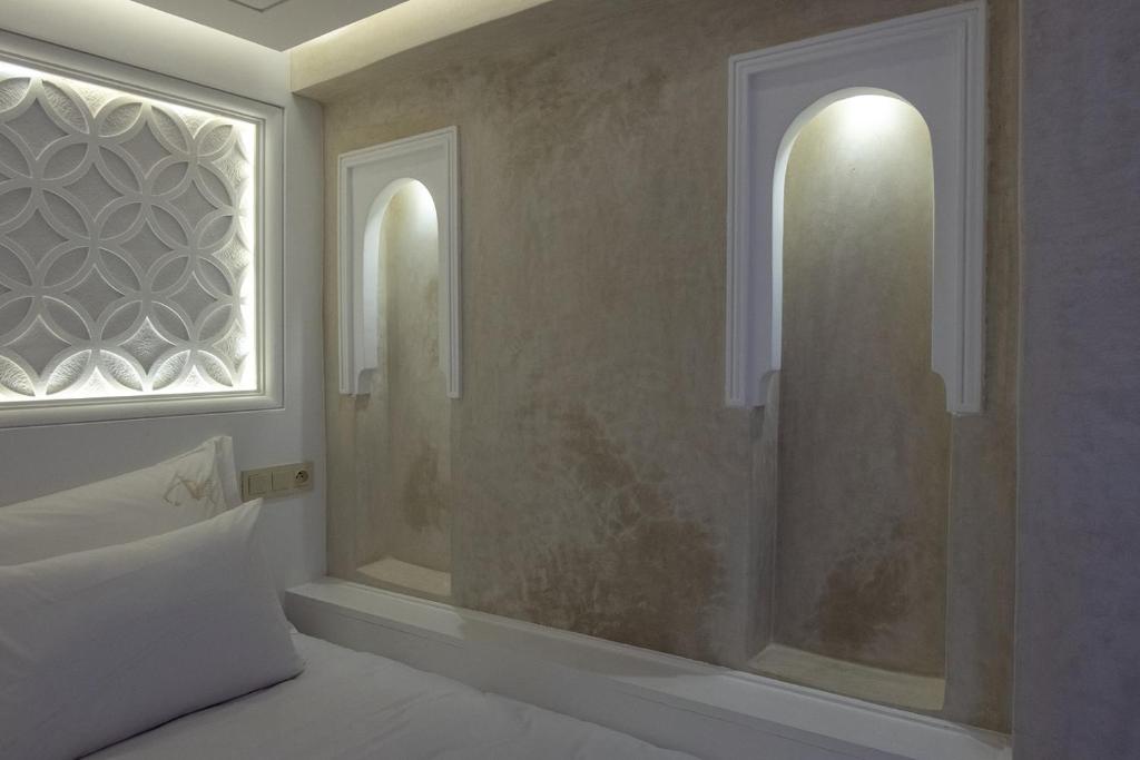 Postel nebo postele na pokoji v ubytování Luxe Nomade Marrakech & Spa