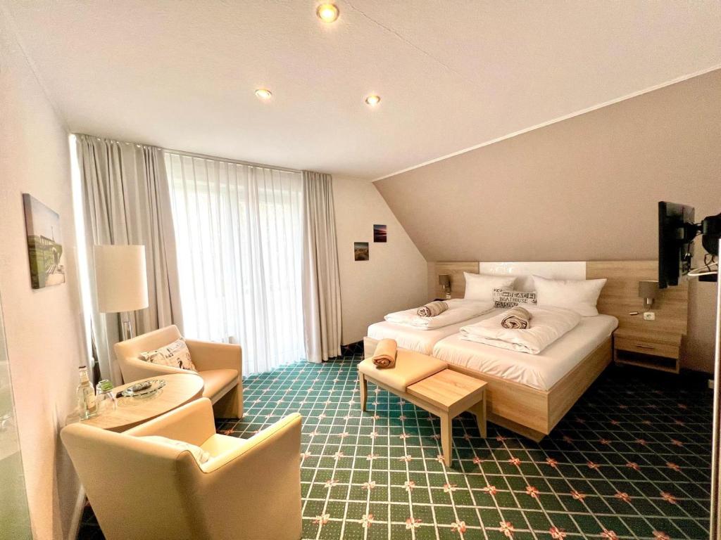 Postel nebo postele na pokoji v ubytování Kirchspielkrug Landhotel & Restaurant