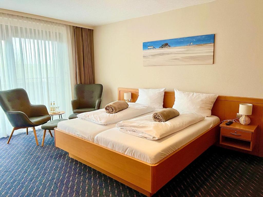 Postel nebo postele na pokoji v ubytování Kirchspielkrug Landhotel & Restaurant