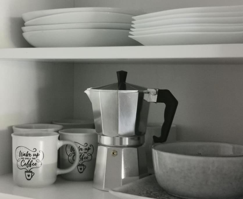a kitchen counter with a mixer and cups on a shelf at Central Calpe, 4min walk to the beach in Calpe
