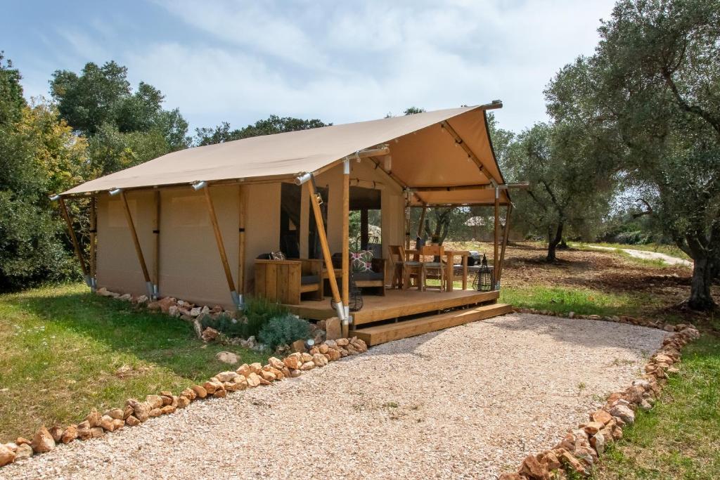 a gazebo with a tent in a field at Domus Olea Glamping in Ceglie Messapica