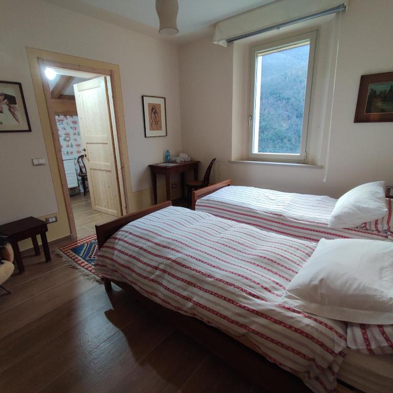 Postel nebo postele na pokoji v ubytování CantoQuinto Bed and Breakfast