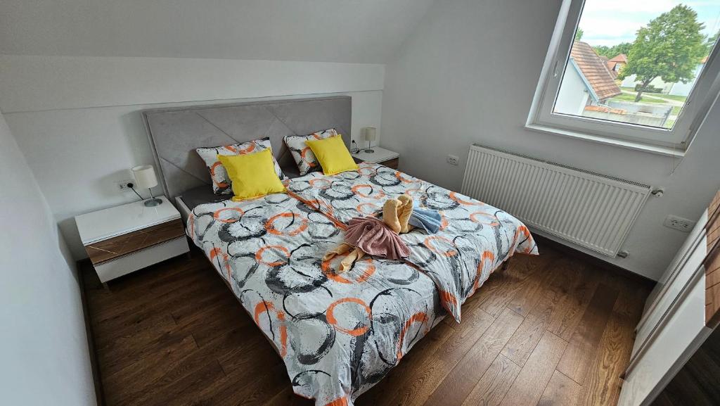 a bedroom with a large bed and a window at Office Escape - holiday home in Terme Čatež in Brežice