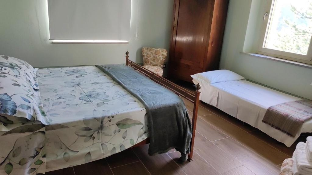 Postel nebo postele na pokoji v ubytování CantoQuinto Bed and Breakfast