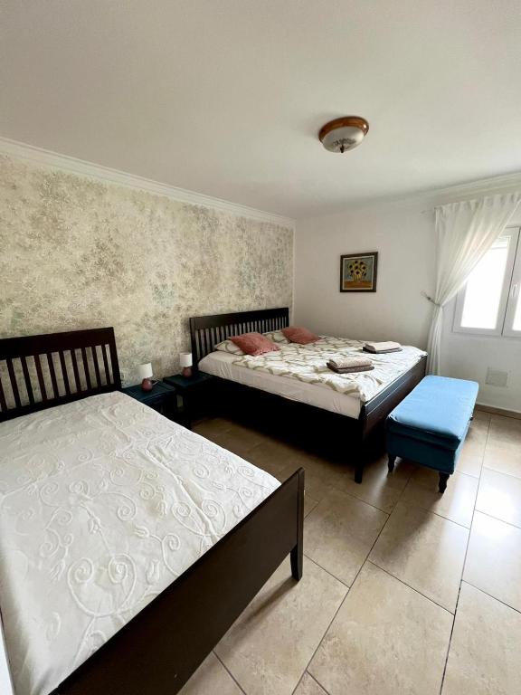 Postel nebo postele na pokoji v ubytování Mareverde Casa Eviwa I-118 by VivaTenerife