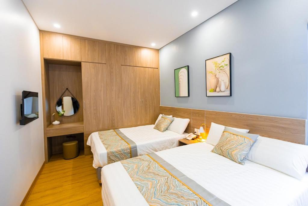 Postel nebo postele na pokoji v ubytování Tropic Bloom Hotel