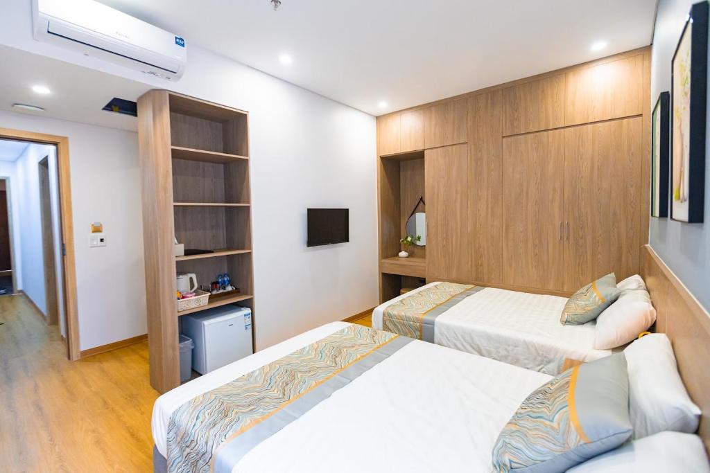 Postel nebo postele na pokoji v ubytování Tropic Bloom Hotel