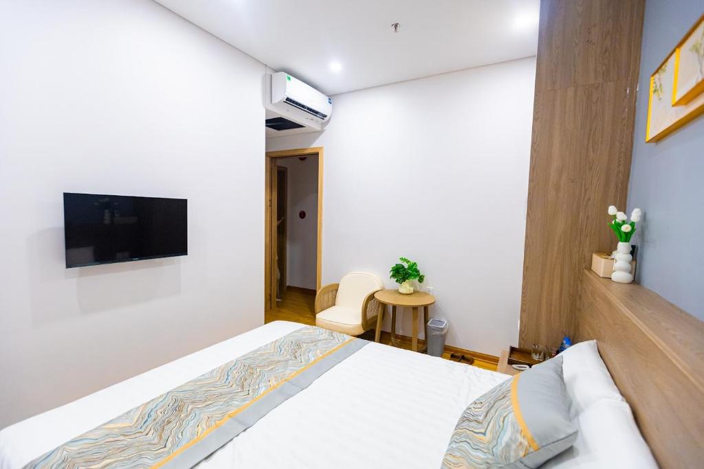 TV a/nebo společenská místnost v ubytování Tropic Bloom Hotel