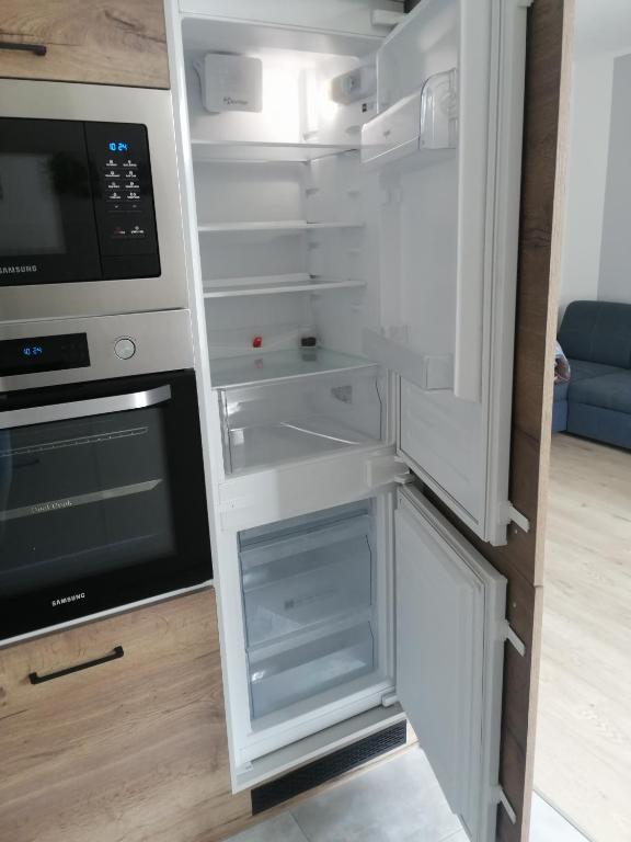 Kuchyň nebo kuchyňský kout v ubytování Apartament Zielone Wzgórze