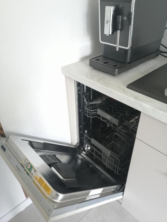 Kuchyň nebo kuchyňský kout v ubytování Apartament Zielone Wzgórze 2