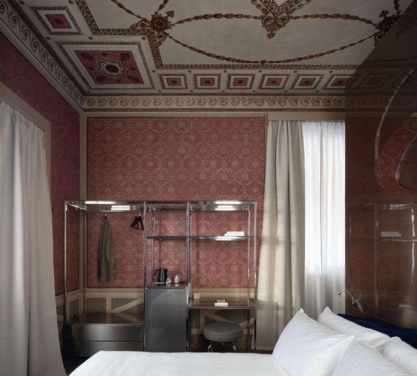 Postel nebo postele na pokoji v ubytování Interno Marche Design Experience Hotel