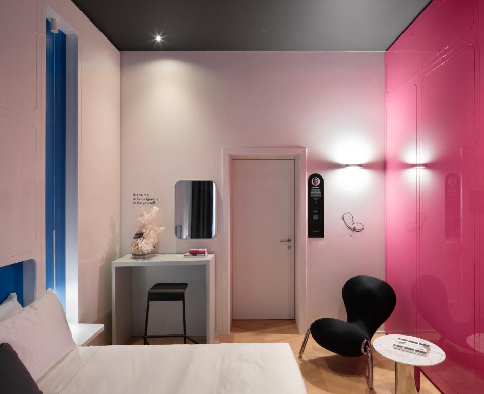 Postel nebo postele na pokoji v ubytování Interno Marche Design Experience Hotel