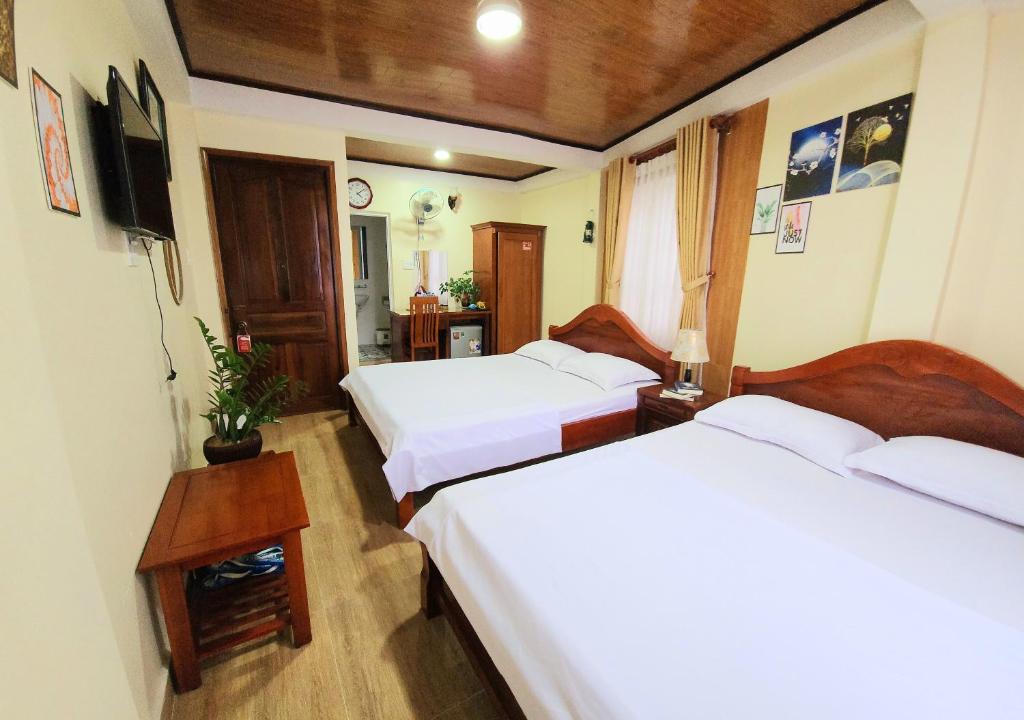 Postel nebo postele na pokoji v ubytování Bình Đào Hotel - Khách sạn ngay trung tâm giá rẻ