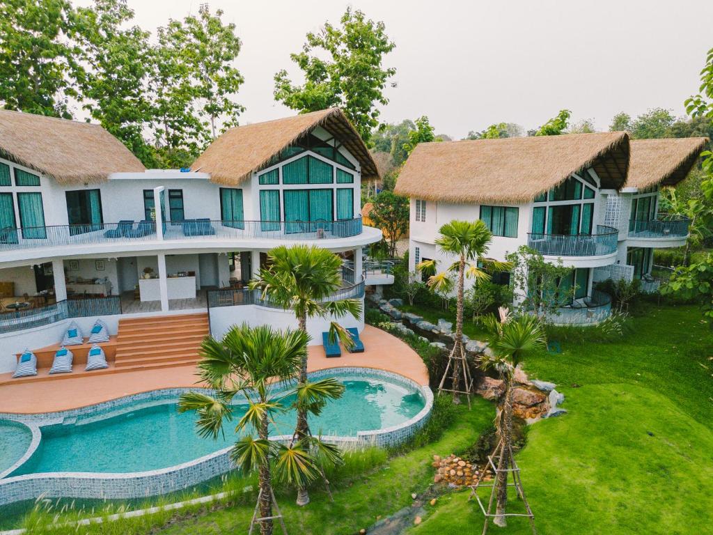 an aerial view of a resort with a swimming pool at Villa De Leaf River Kaeng Krachan in Phetchaburi