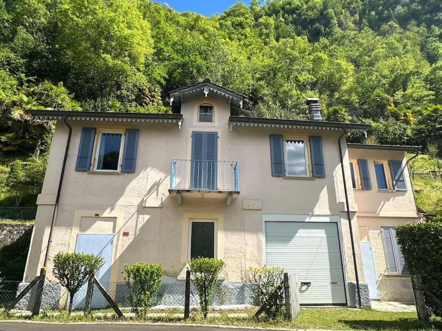 a large house with a balcony on top of it at Casa Lilia in Lugano