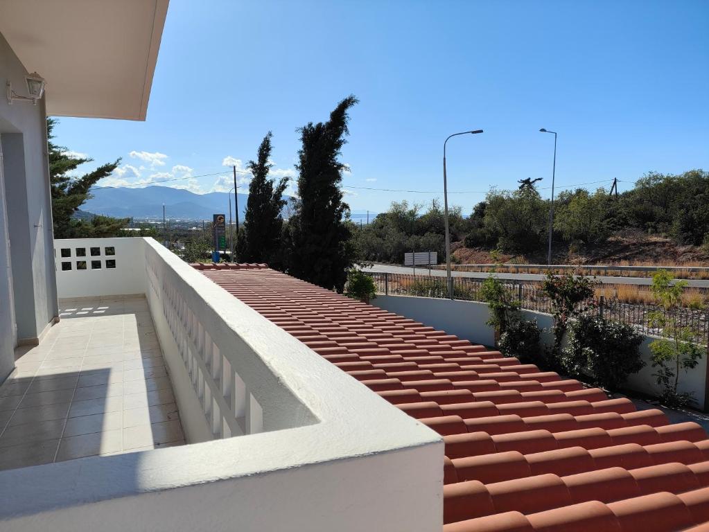 a balcony of a house with red bricks on it at Tarmaros Apartments in Sissi