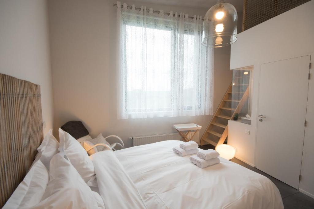 Postel nebo postele na pokoji v ubytování Maison d'Hôtes Cerf'titude