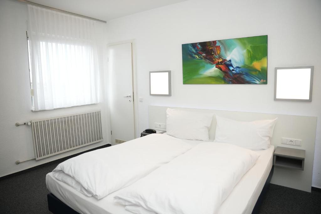 Postel nebo postele na pokoji v ubytování Weber Residenz