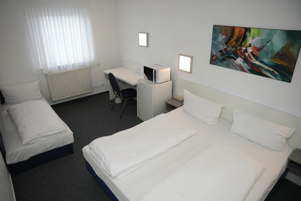Postel nebo postele na pokoji v ubytování Weber Residenz