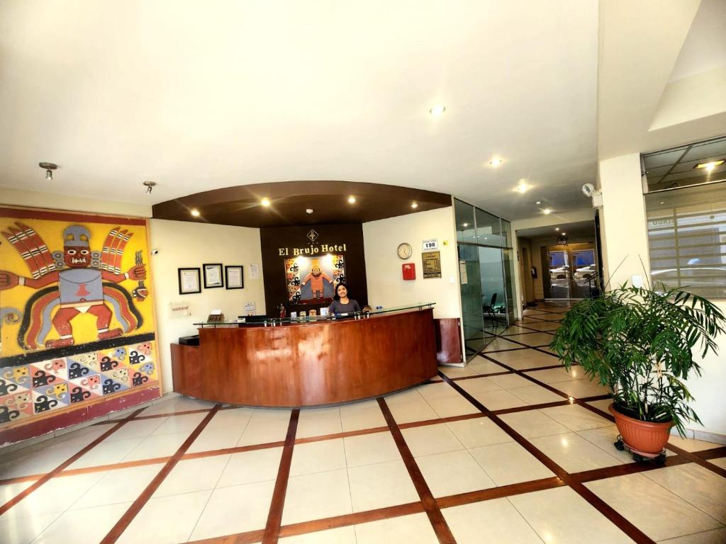 a lobby of a hotel with a reception desk at Hotel El Brujo Centro Histórico in Trujillo