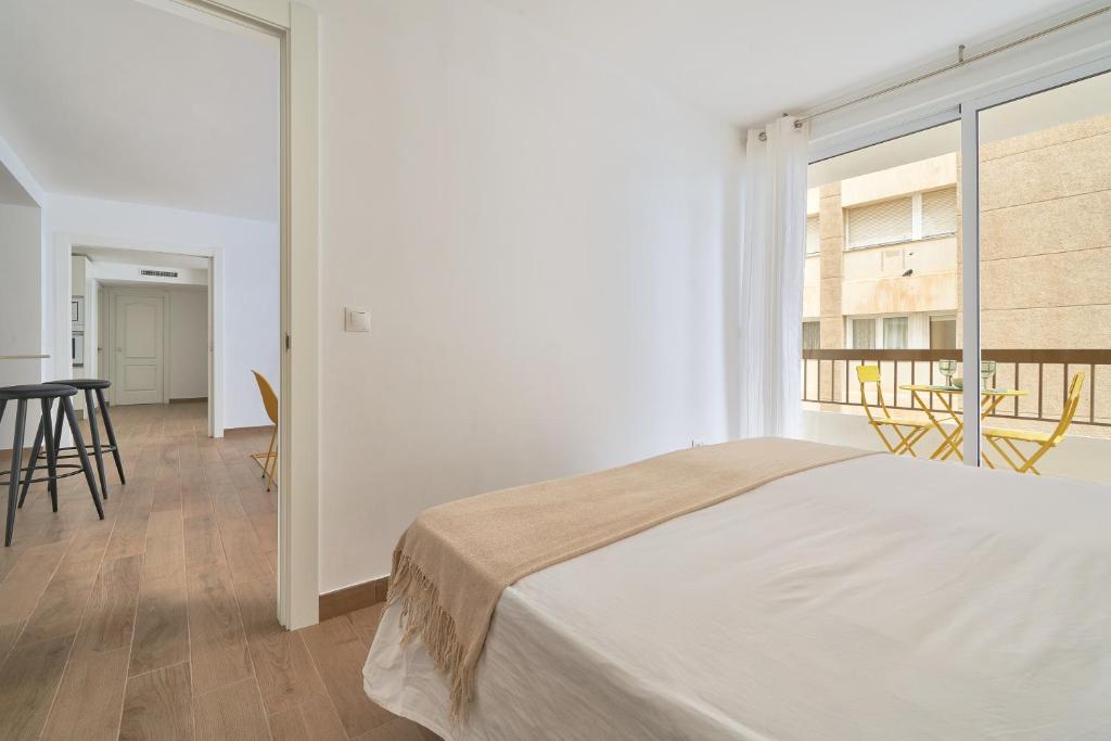 Łóżko lub łóżka w pokoju w obiekcie Apartamento en primera linea de playa en la Malagueta