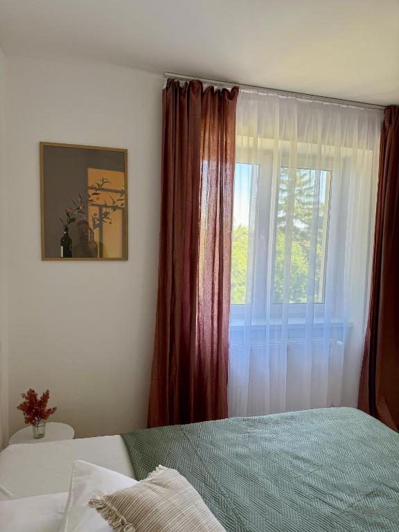 Postel nebo postele na pokoji v ubytování Apartment ZOi