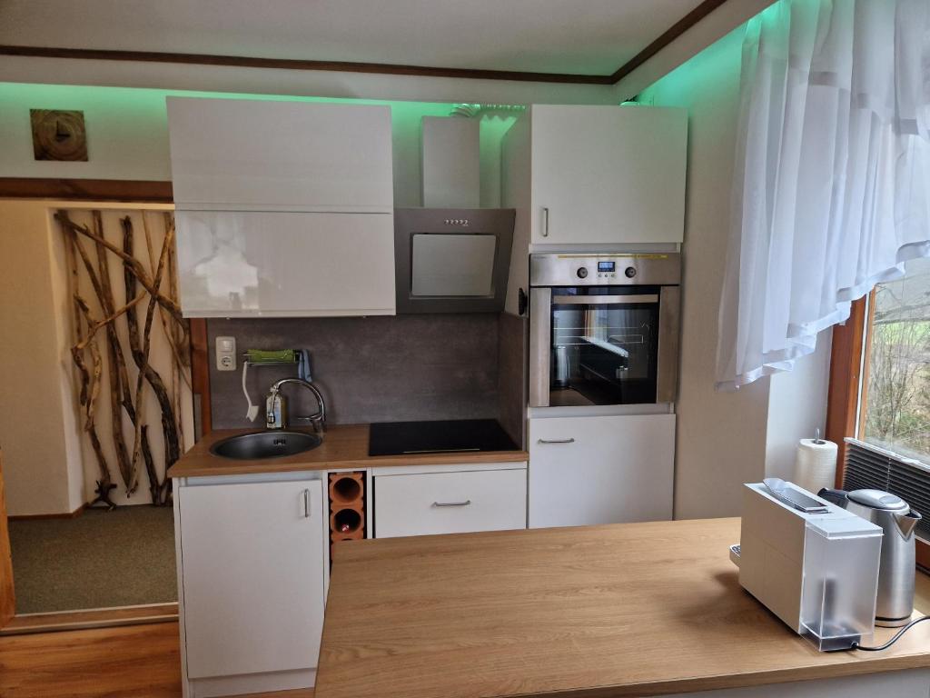 Kuchyň nebo kuchyňský kout v ubytování Apartment feelthenature