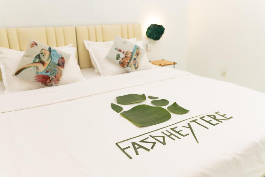 Postel nebo postele na pokoji v ubytování Fasdheythere Inn Maldives
