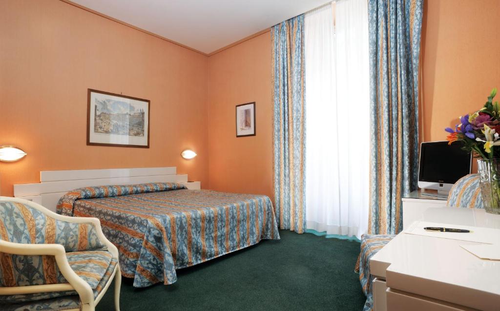 Postel nebo postele na pokoji v ubytování Hotel Patria