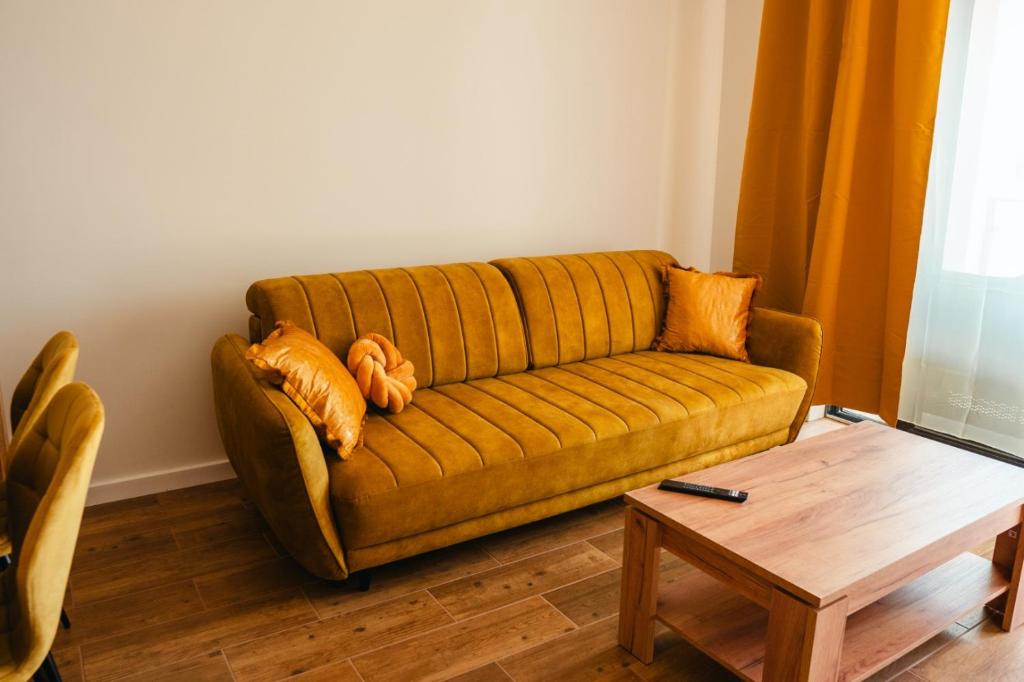 a living room with a couch and a coffee table at Boszkowo Horizon Park in Boszkowo-Letnisko