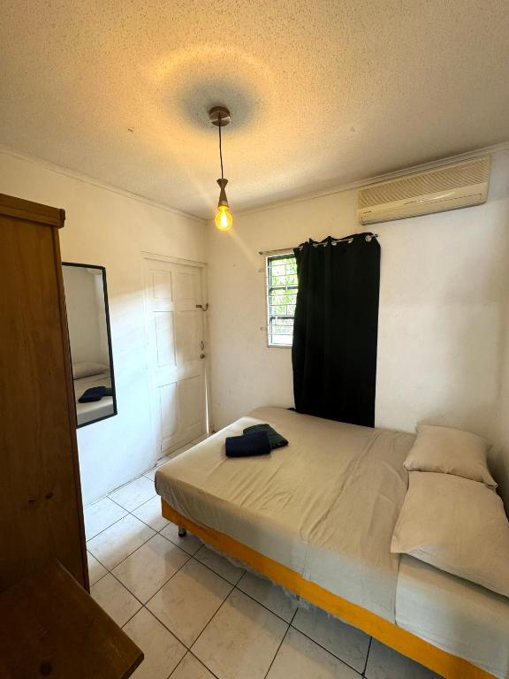 Postel nebo postele na pokoji v ubytování Kenepa Resort