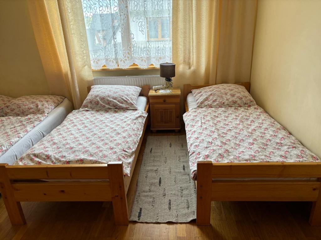 Posteľ alebo postele v izbe v ubytovaní Pokoje Gościnne U Gordona
