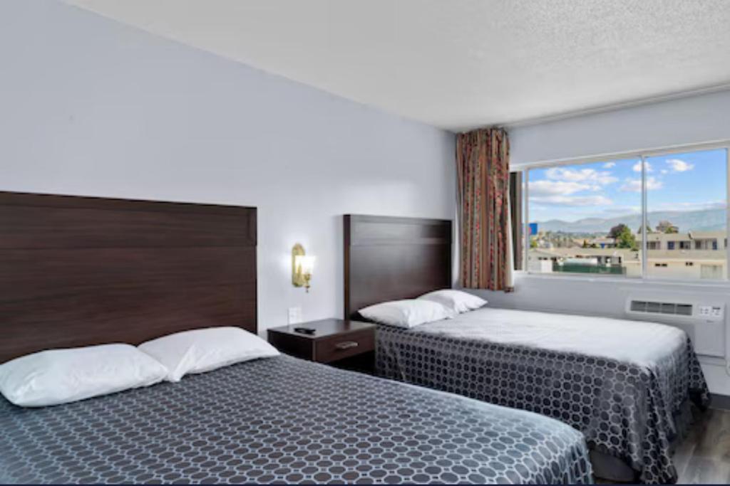 מיטה או מיטות בחדר ב-Holiday Lodge