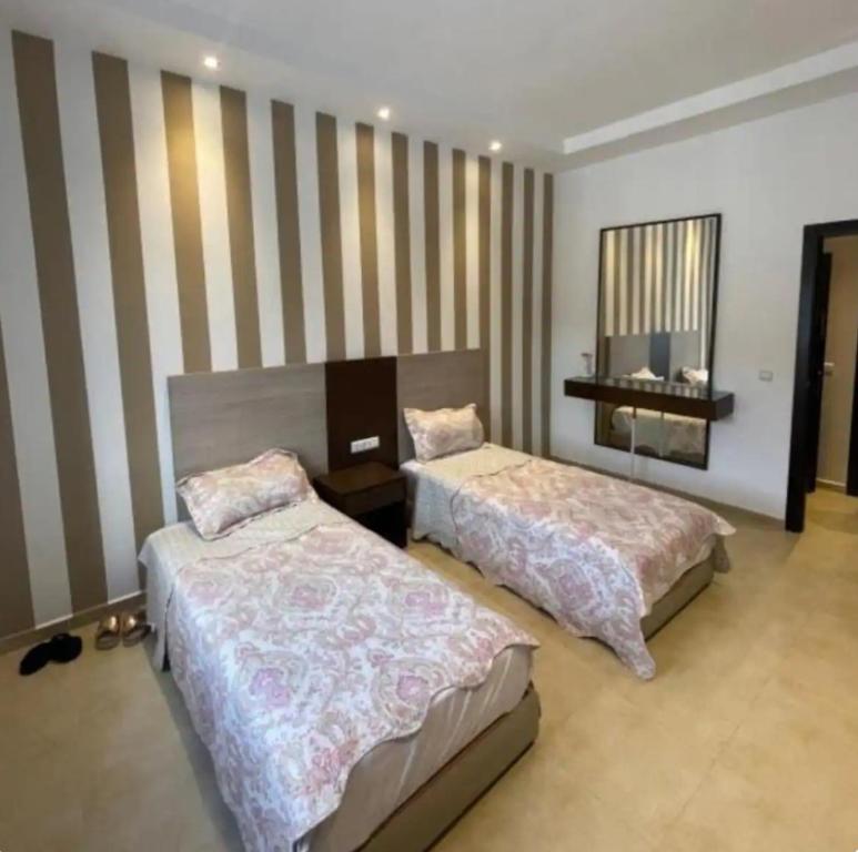 Säng eller sängar i ett rum på Appartement Kariat Cabo