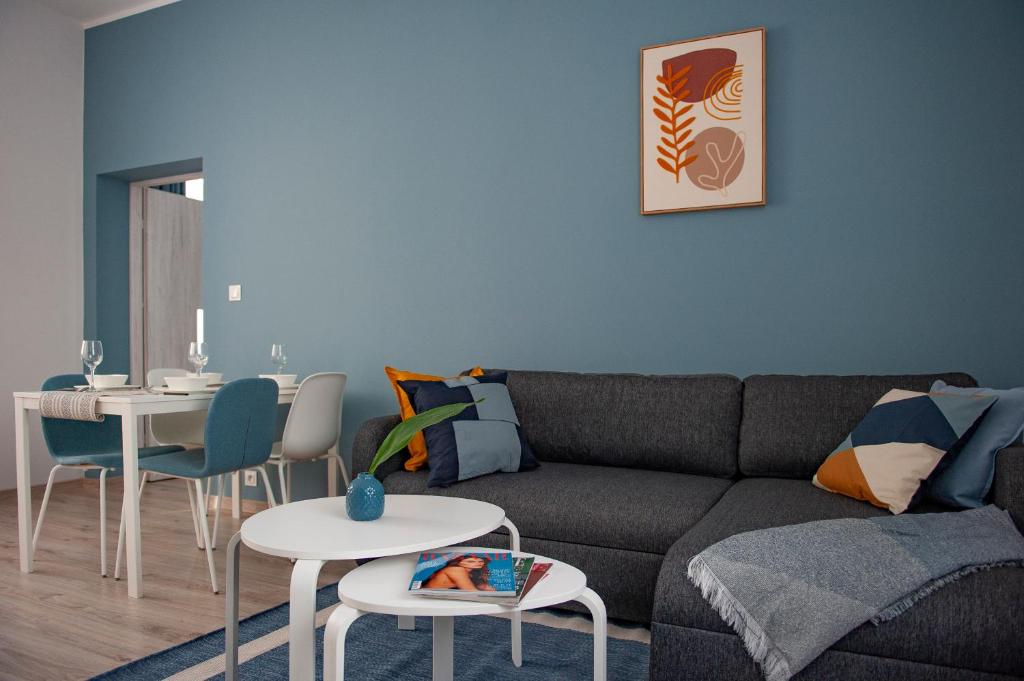 a living room with a couch and a table at Apartamenty Emilia 2 in Gniezno
