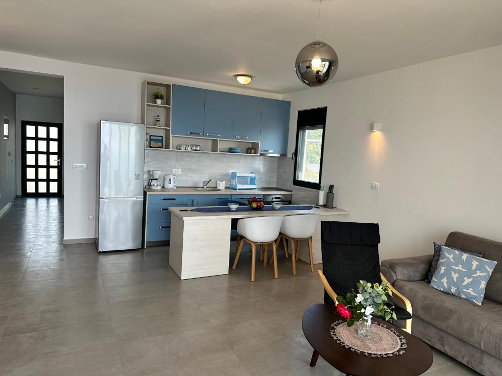 Kuchyň nebo kuchyňský kout v ubytování White Star Apartments