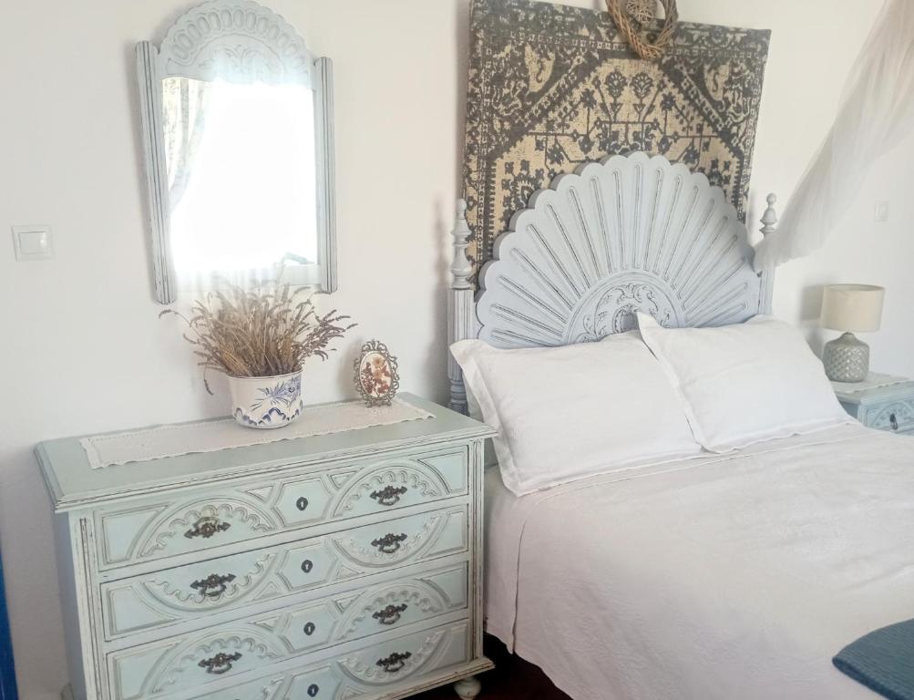 a bedroom with a white bed and a dresser at Sunset Vista apartment A in Cardigos