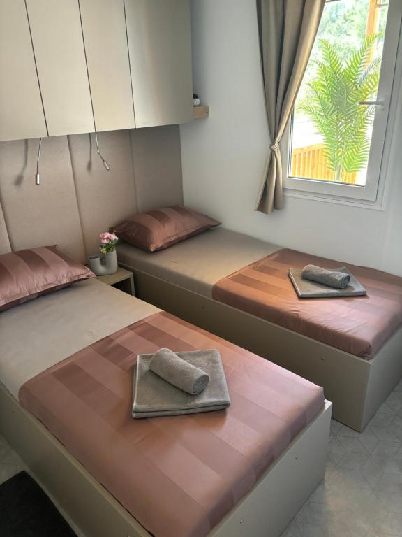 Postel nebo postele na pokoji v ubytování Ayana Mobile Home