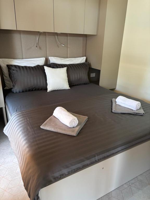 Postel nebo postele na pokoji v ubytování Ayana Mobile Home