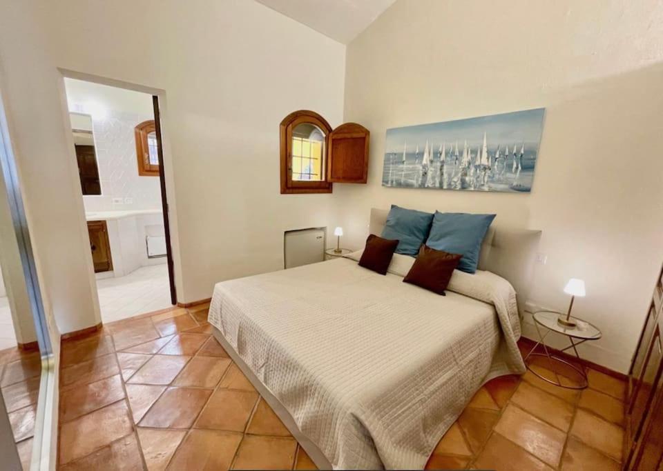 Giường trong phòng chung tại Villetta sulla Promenade du Port