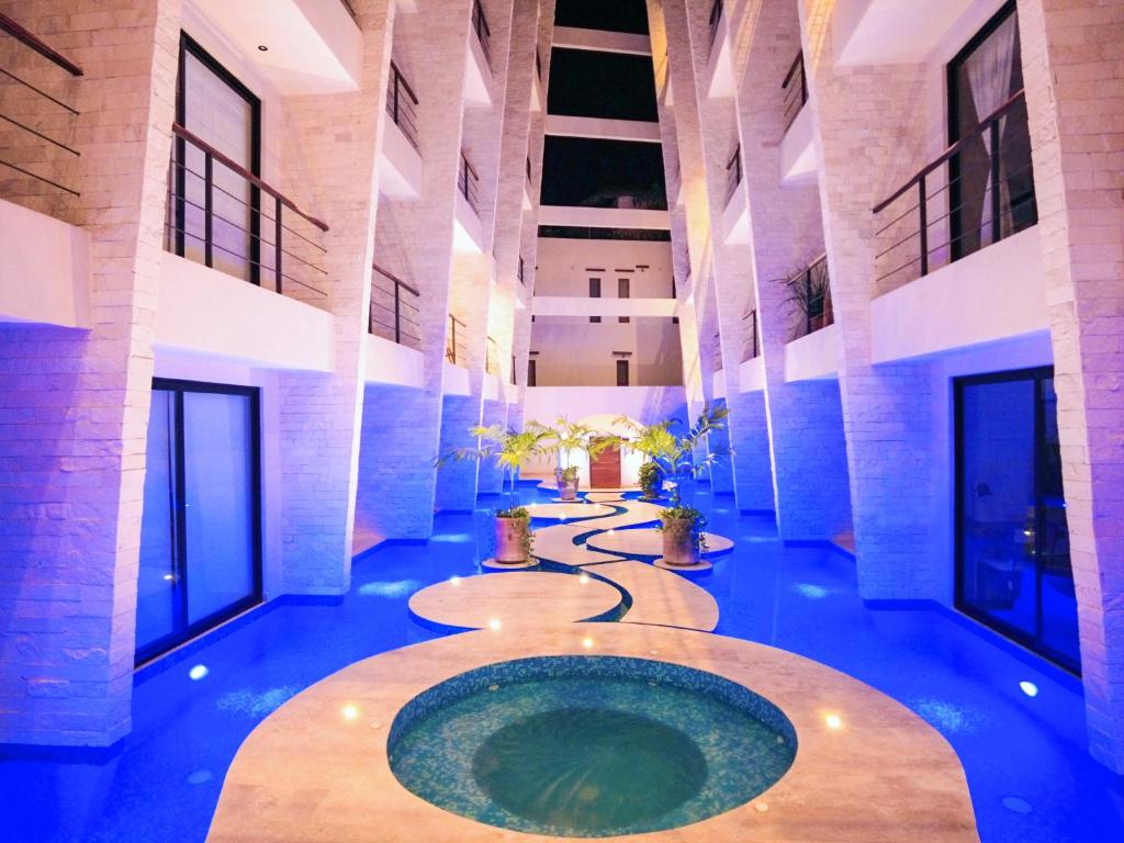 a pool in the middle of a building at Akua Tulum Mexico in Tulum