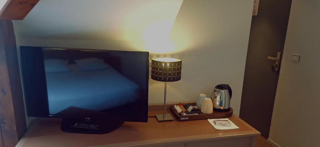 TV a/nebo společenská místnost v ubytování Beau Rivage