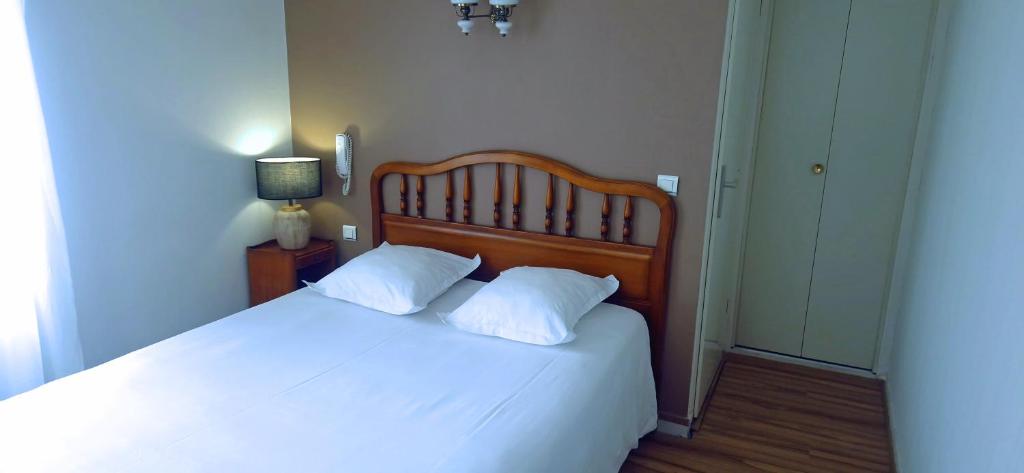 Postel nebo postele na pokoji v ubytování Beau Rivage