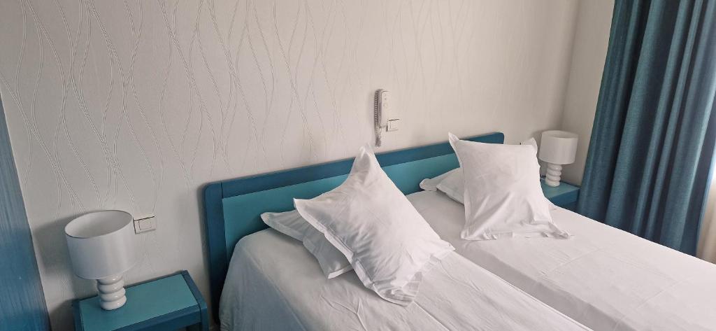 Postel nebo postele na pokoji v ubytování Beau Rivage